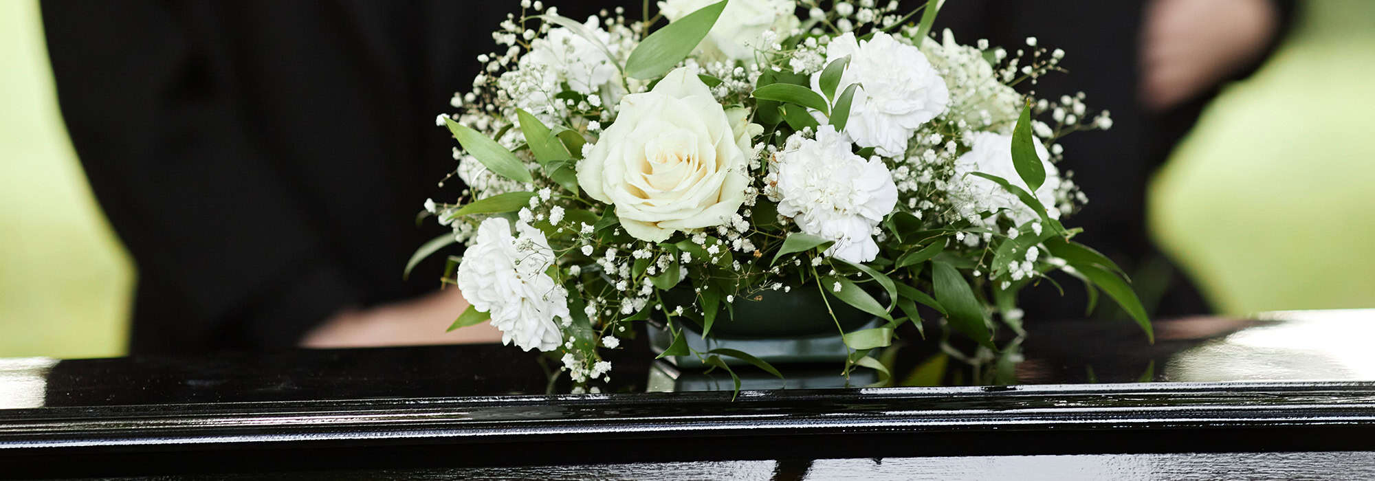 flowers on top of a casket