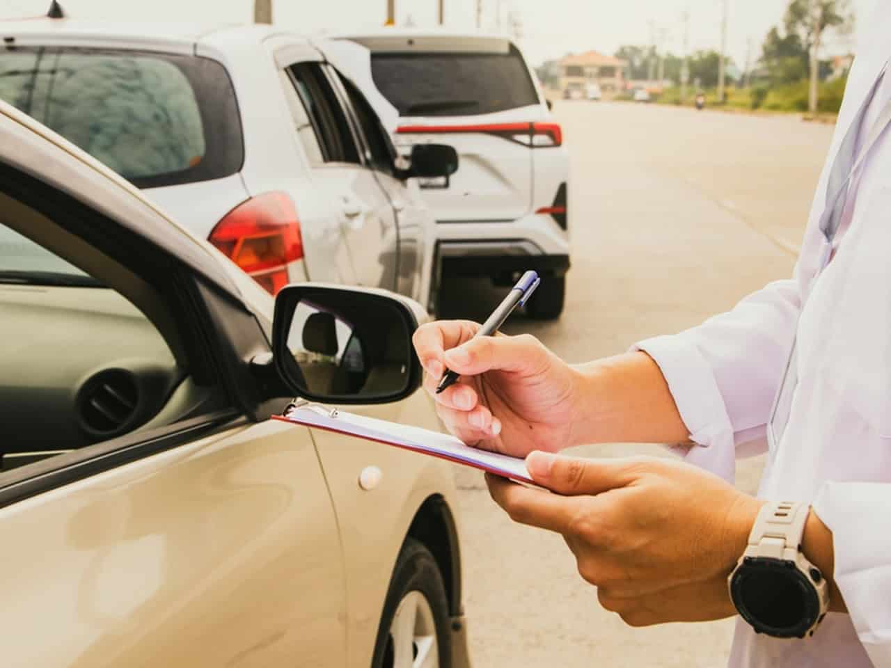 insurance adjuster at a car accident scene
