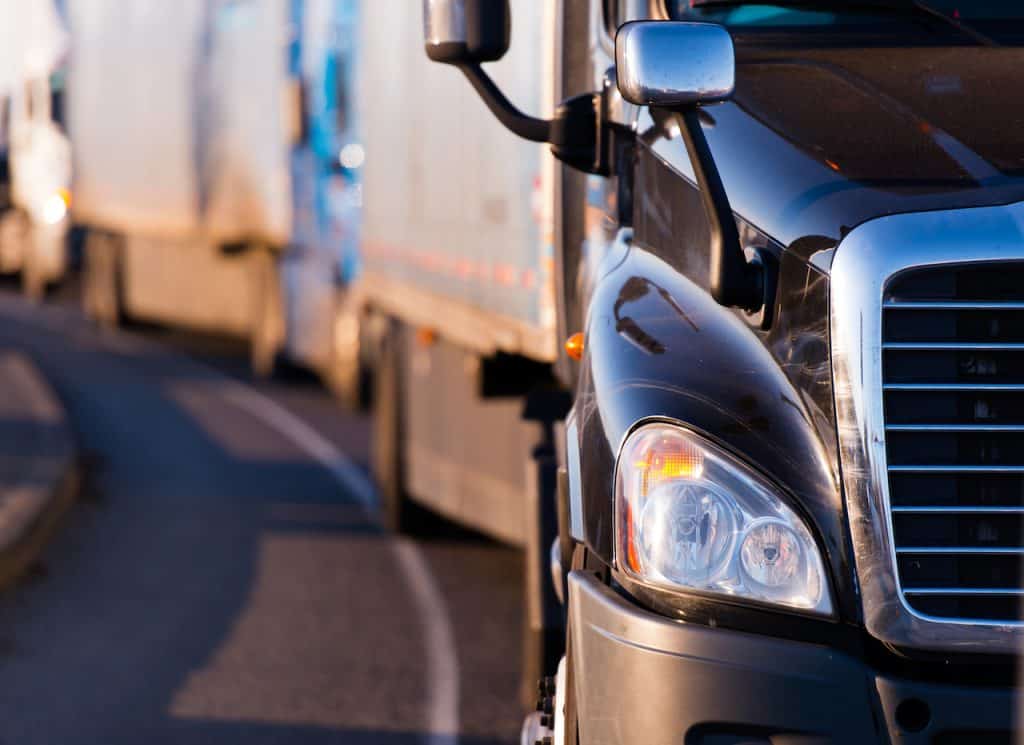 several trucks in traffic