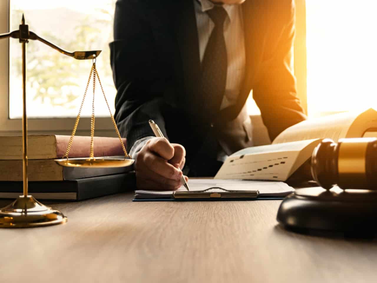 attorney signing a legal document