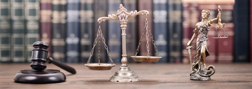 gavel, scales of justice, and lady justice statue