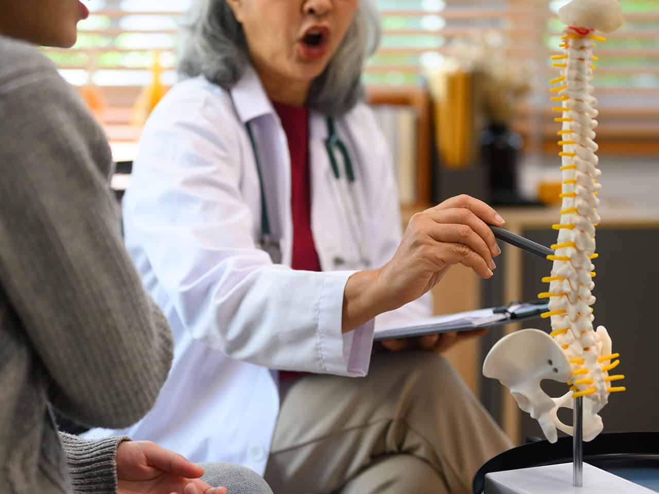 Doctor reviewing spine injury with patient