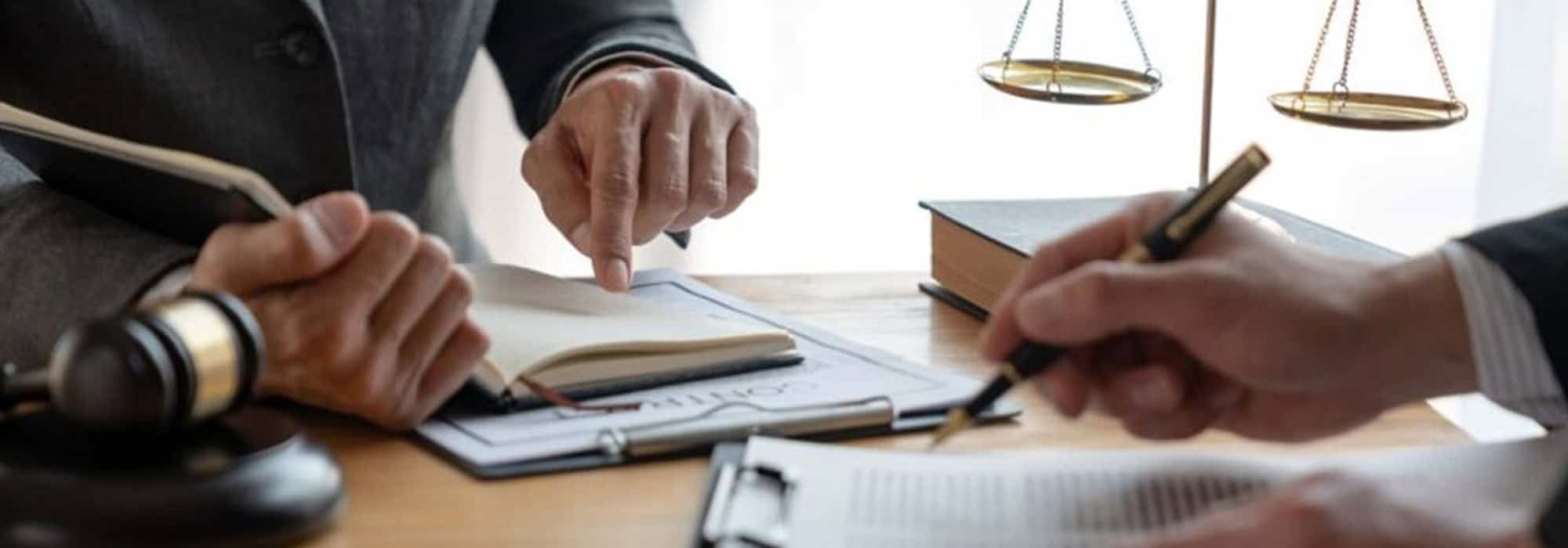 Two attorneys reviewing case notes