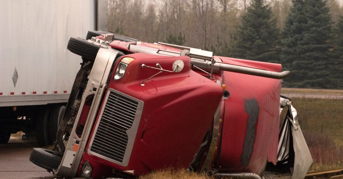 Truck on its Side on a Canal on The Road