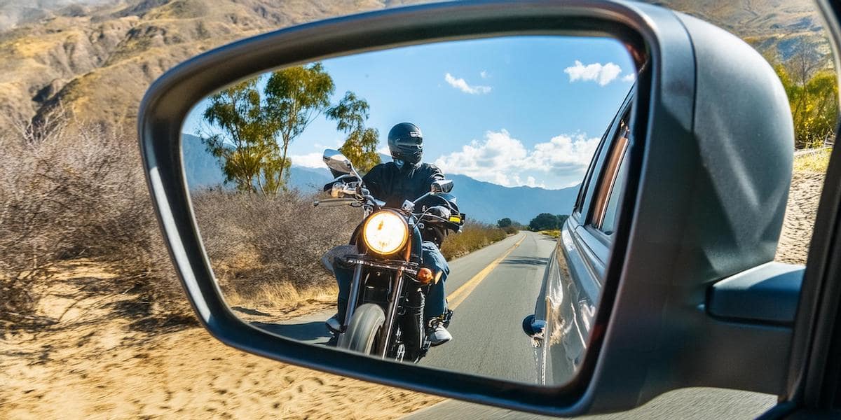 Motorcycle in rear-view mirror